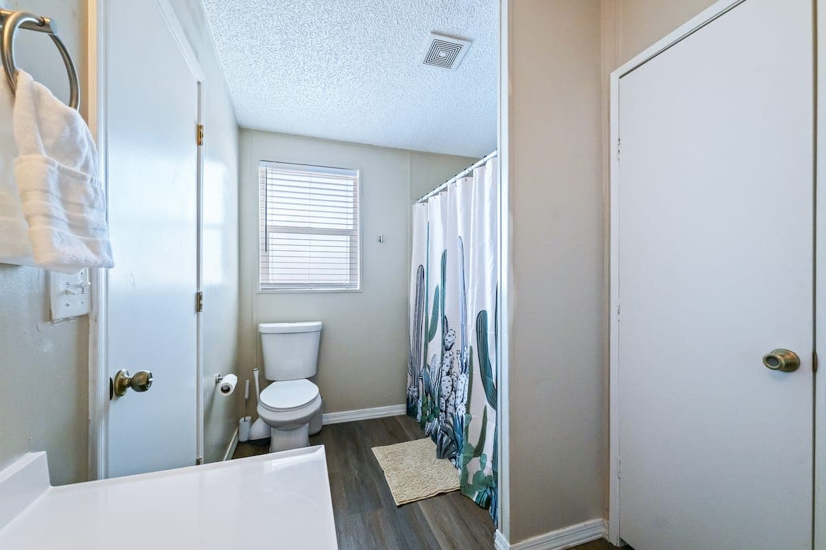 Bathroom with a dark vanity and shower