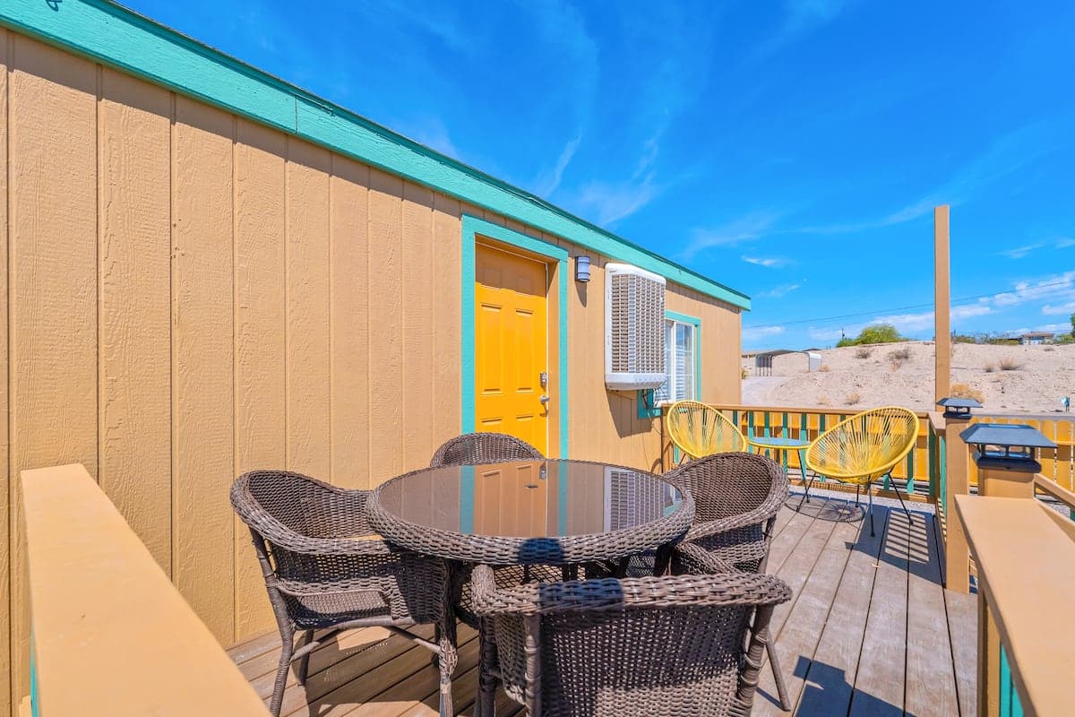 Outdoor dining table and chairs on the home’s deck