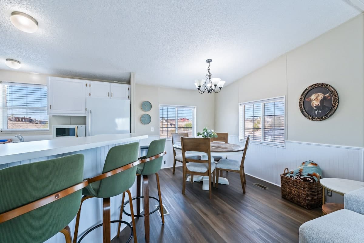 Dining table and kitchen in the open-plan living space