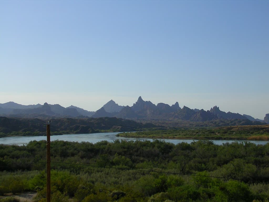 Colorado River flowing through Topock Gorge with desert mountains beyond